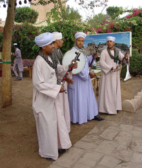 Photograph of men wearing loose white clothing