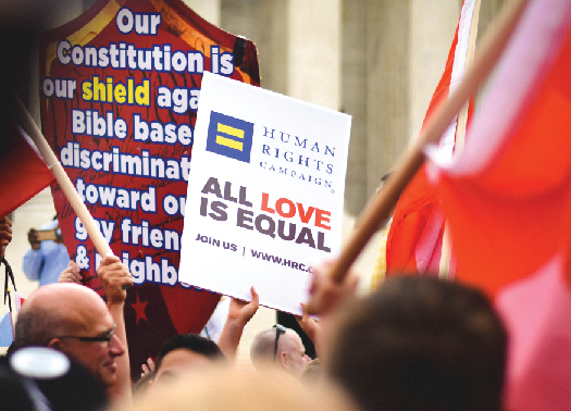An image of a sign reading “Human rights campaign all love is equal”.