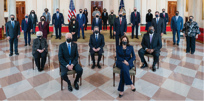 President Joe Biden and Vice President Kamala Harris and Presidential Cabinet members in the Grand Foyer of the White House. Seated in the second row, from left, are: Treasury Secretary Janet Yellen, Secretary of State Antony Blinken, and Defense Secretary Lloyd Austin. Standing in the third row, from left, are: Health and Human Services Secretary Xavier Becerra, Commerce Secretary Gina Raimondo, Interior Secretary Deb Haaland, Agriculture Secretary Tom Vilsack, Labor Secretary Marty Walsh, and Housing and Urban Development Secretary Marcia Fudge. Standing in the fourth row, from left, are: Homeland Security Secretary Alejandro Mayorkas, Attorney General Merrick Garland, and Environmental Protection Agency Administrator Michael Regan. Standing in the fifth row, from left, are: Small Business Administrator Isabel Guzman, U.S. Permanent Representative to the United Nations Linda Thomas-Greenfield, Education Secretary Miguel Cardona, Transportation Secretary Pete Buttigieg, Energy Secretary Jennifer Granholm, Veterans Affairs Secretary Denis McDonough, Council of Economic Advisers Chair Cecilia Rouse, and Chief of Staff Ron Klain. Standing in the sixth row, from left, are: National Intelligence Director Avril Haines, Office of Management and Budget Acting Director Shalanda Young, and U.S. Trade Representative Katherine Tai.