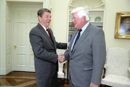 An image of Ronald Reagan shaking hands with Tip O’Neil.