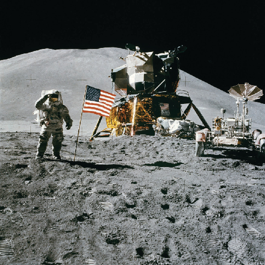 A photo of an astronaut on the moon standing next to the American flag.