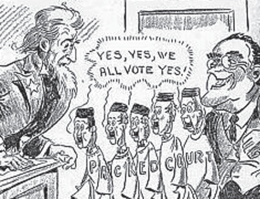 An illustration of seven people. On the left is an Uncle Sam figure. On the right is a person in a suit with a wide grin and glasses. In between the two people are five people in robes. Letters across all of the robes read “Packed Court”. A speech bubble above the five people in robes reads “Yes, Yes, we all vote yes!”.