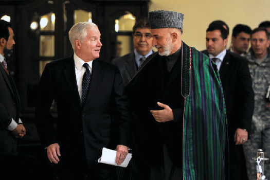 An image of Robert Gates speaking with Hamid Karzai.