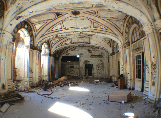 An image of the inside of a dilapidated building.