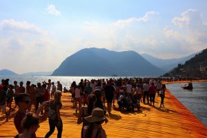 People shown walking through the floating piers.