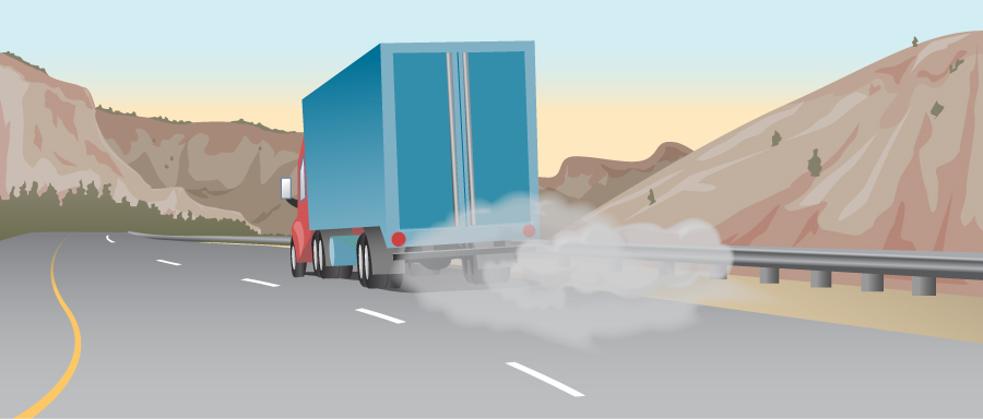 Figure shows a truck on a road. There is smoke near its tires.