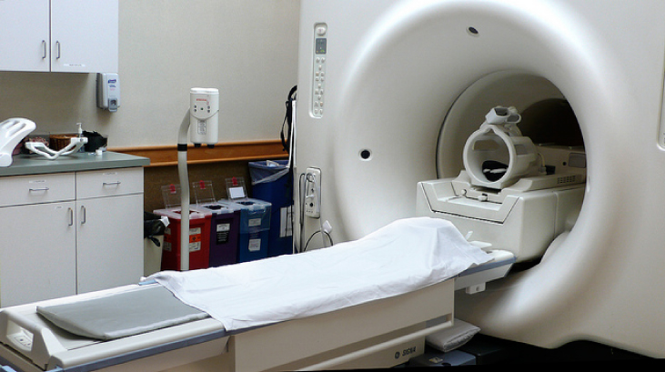 Photo shows an MRI system. It consists of the cylindrical solenoid that is used to generate a large magnetic field.