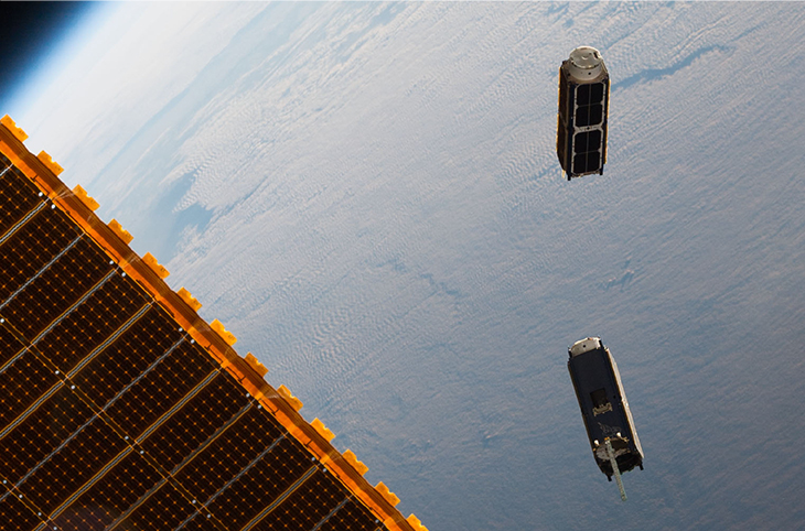 Photograph showing two artificial satellites.