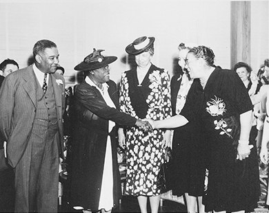 A photograph depicts Mary McLeod Bethune, Eleanor Roosevelt, and several others at the opening of Midway Hall.