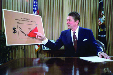 A photograph shows Reagan sitting at a desk, gesturing at a large chart labeled “Your Taxes.”