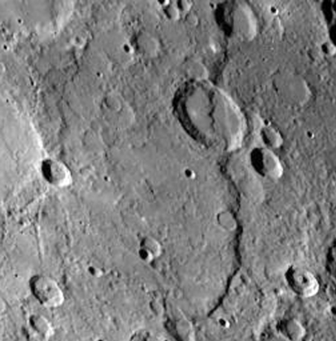 Large Scarp on Mercury. This long cliff structure crosses both flat lands and craters as it extends down the right hand side of this image.