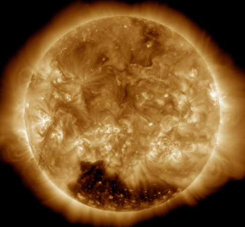 An image of a coronal hole, a large dark splotch at the bottom of the sun.