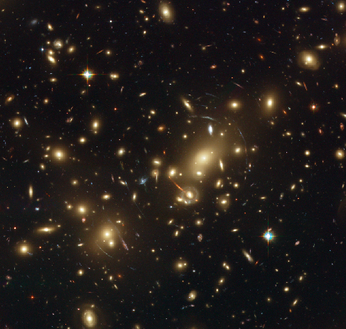Cluster Abell 2218. This view from HST shows the massive galaxy cluster Abell 2218. Many concentric arcs of light can be seen surrounding the central parts of the cluster, located to the right of center.
