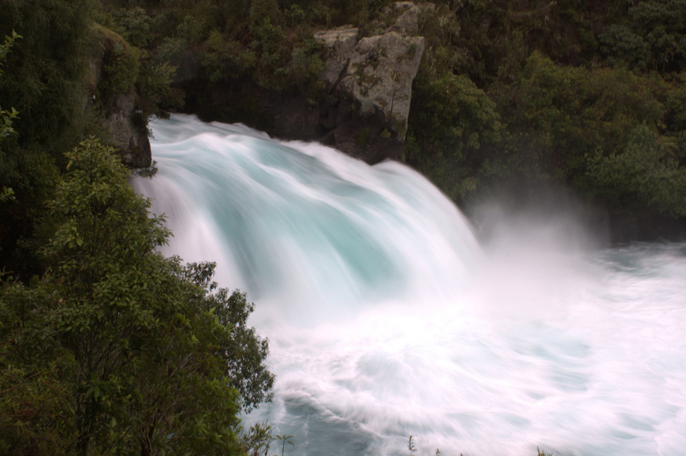 Water rushes over a fall.